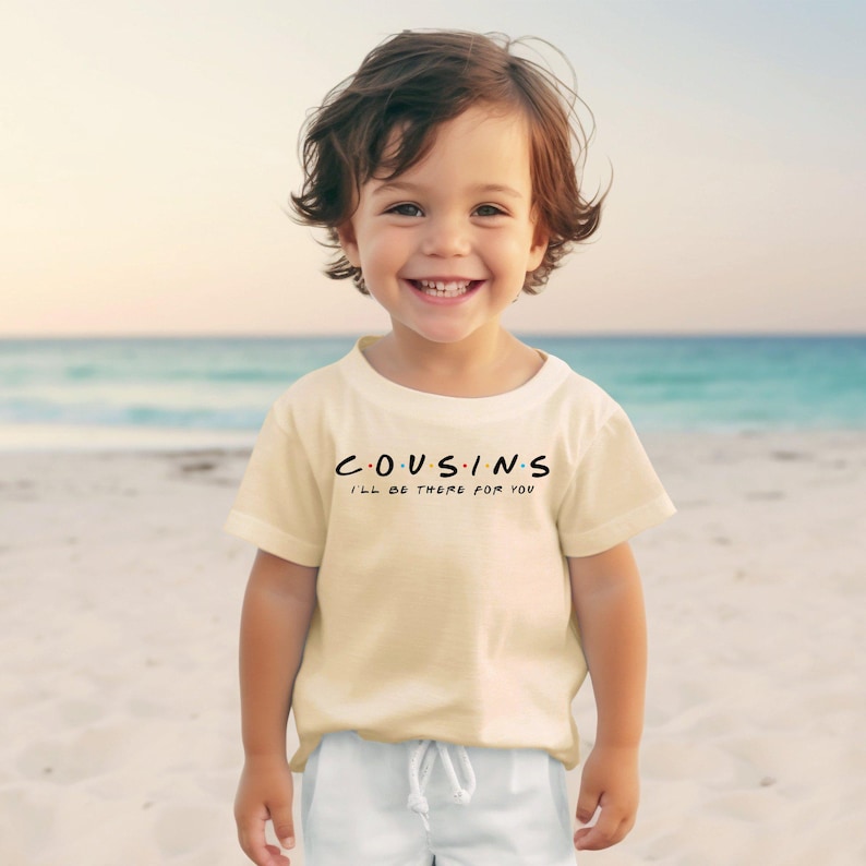 a little boy that is standing in the sand
