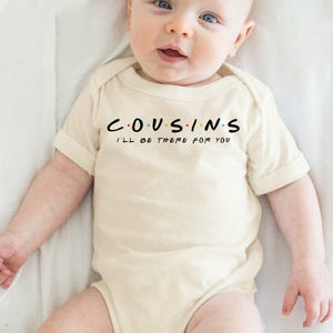a baby wearing a bodysuit that says cousins i'll be there