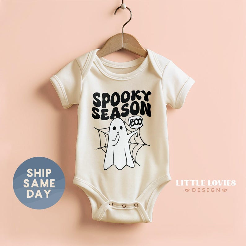 a baby bodysuit with a ghost saying spooky season on it