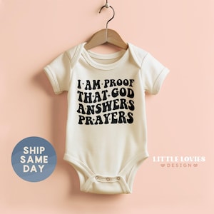I Am Proof That God Answers Prayer Onesie®, Scripture Baby Bodysuit, Bible Verse Baby Bodysuit, Newborn Christian Kids Shirt, (CA-REL11)