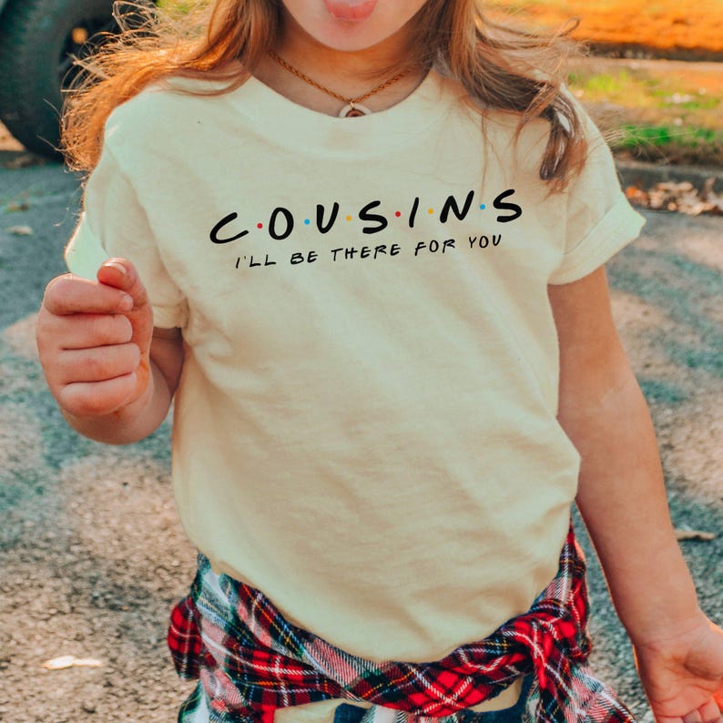 a young girl making a funny face with her tongue out