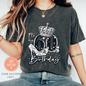 a woman wearing a birthday shirt with a crown on it