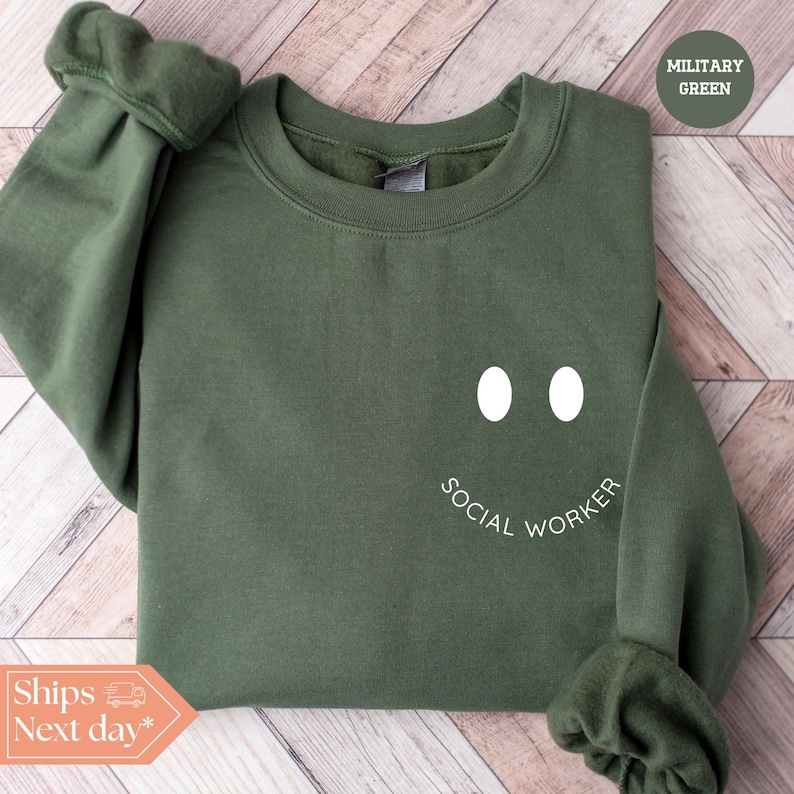 a green sweatshirt with the words social worker on it