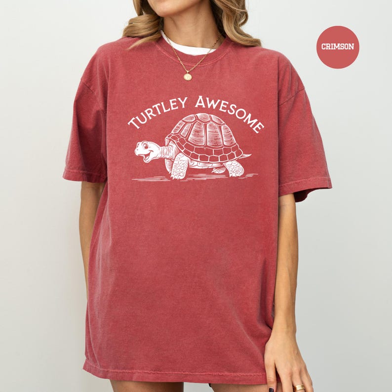 A red t-shirt with a white graphic of a turtle and the text "TURTLEY AWESOME" printed on it.