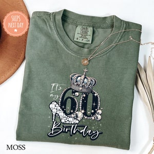 a green birthday shirt with a tiara on it