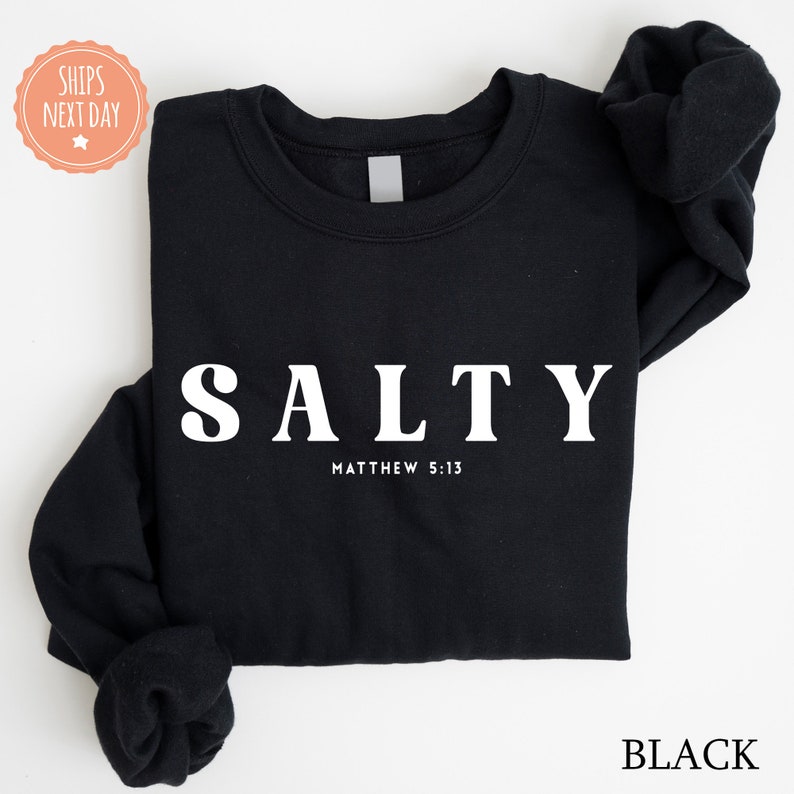 a black shirt with the word salty printed on it