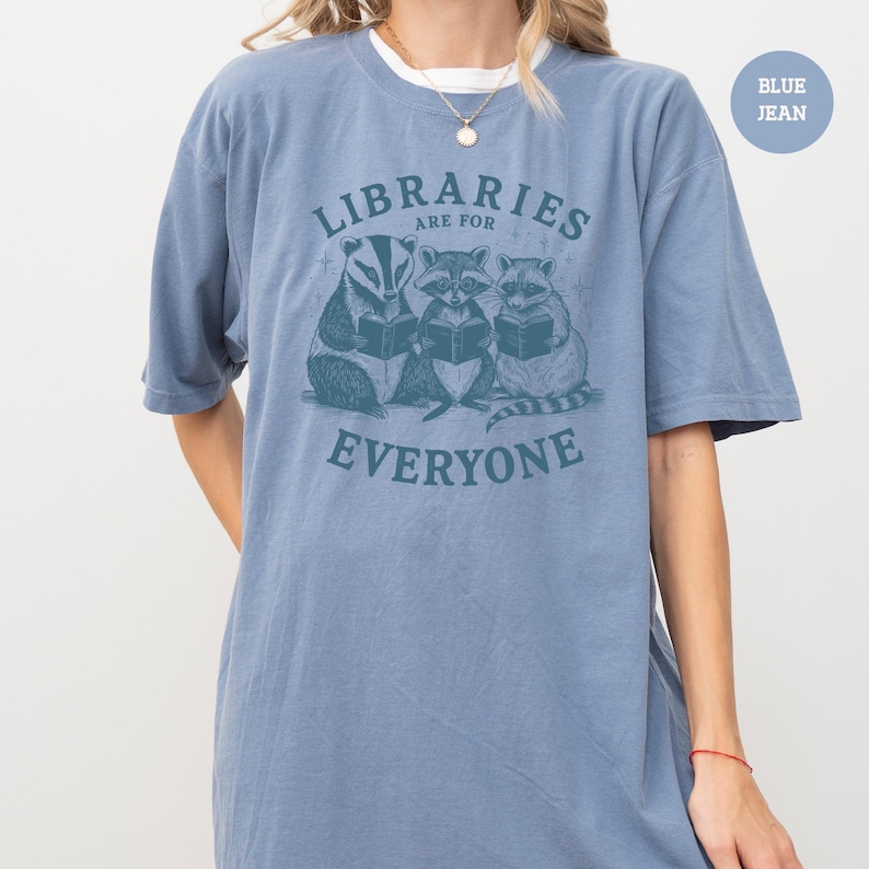 a woman wearing a blue shirt that says librarians are for everyone