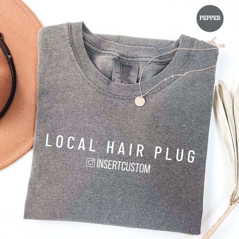 a pair of sunglasses, a hat, and a t - shirt