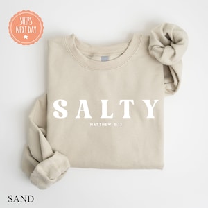 a t - shirt with the word salty printed on it