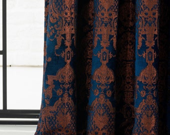 May include: Blue velvet curtains with a copper-colored damask pattern. The curtains are gathered at the bottom and have a soft, luxurious feel.