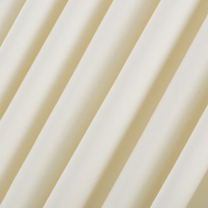 May include: Close-up of a smooth, off-white fabric with a subtle texture. The fabric is folded in a diagonal pattern, creating soft, flowing lines.