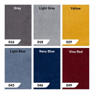 May include: Six fabric swatches in different colors: gray, light gray, yellow, light blue, navy blue, and vine red. Each swatch has a number printed on it: 016, 018, 029, 043, 046, and 049.