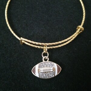 Gold cut adjustable bracelet with football charm made to accommodate most wrist sizes