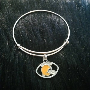 Silver adjustable bracelet with football helmet charm.