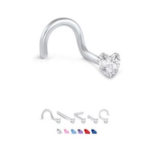 May include: A silver nose ring with a heart-shaped, clear gemstone. The curved post is designed for a comfortable fit. Additional nose rings with different colored gemstones are displayed below the main image.