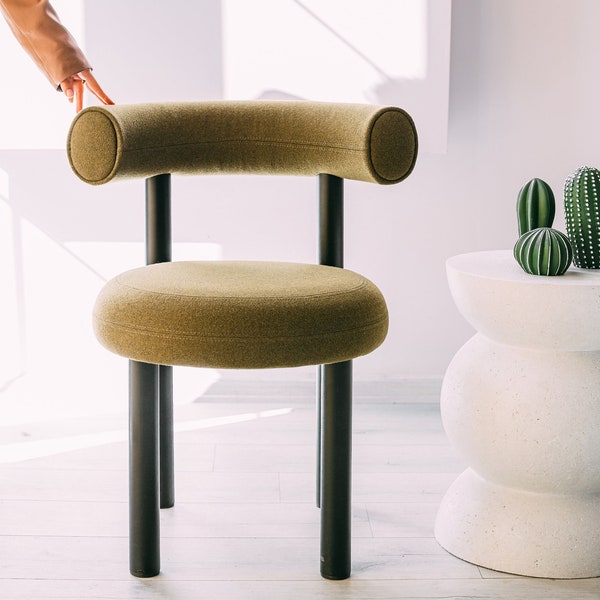 Modern oval shaped metal chair with arms, Armchair with bouclé and plush upholstery fabric, interior design, Dining and kitchen chair