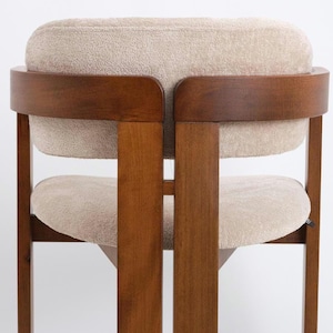 Modern style dining chair, Made of hornbeam wood, Produced by hand, Custom color and fabric options are available.