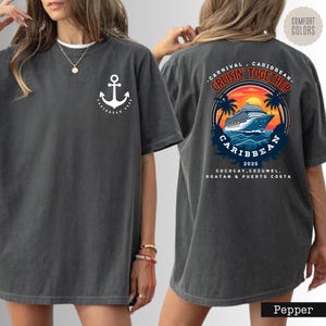 a woman wearing a gray shirt with an anchor on it