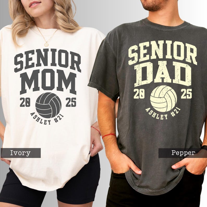 two people wearing t-shirts with text and logos related to volleyball.
