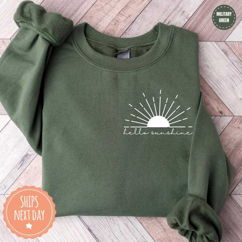 a green sweatshirt with the words hello sunshine on it