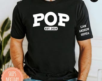 May include: A black short-sleeve t-shirt featuring the white text POP in a bold font, with EST. 2024 printed below it. The left sleeve displays the names LIAM, ANDREW, and SOPHIA in white text. The shirt has a crew neckline and a standard fit.