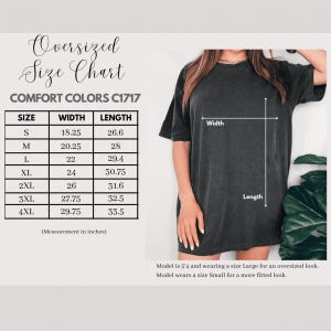 The image is an oversized size chart for a black t-shirt, showing the measurements for different sizes.