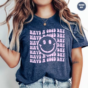 a woman wearing a t - shirt that says have a good day have a good