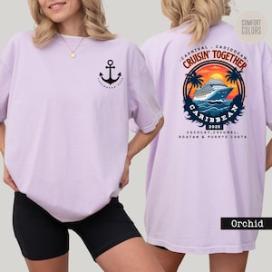 a woman wearing a purple shirt with an anchor on it