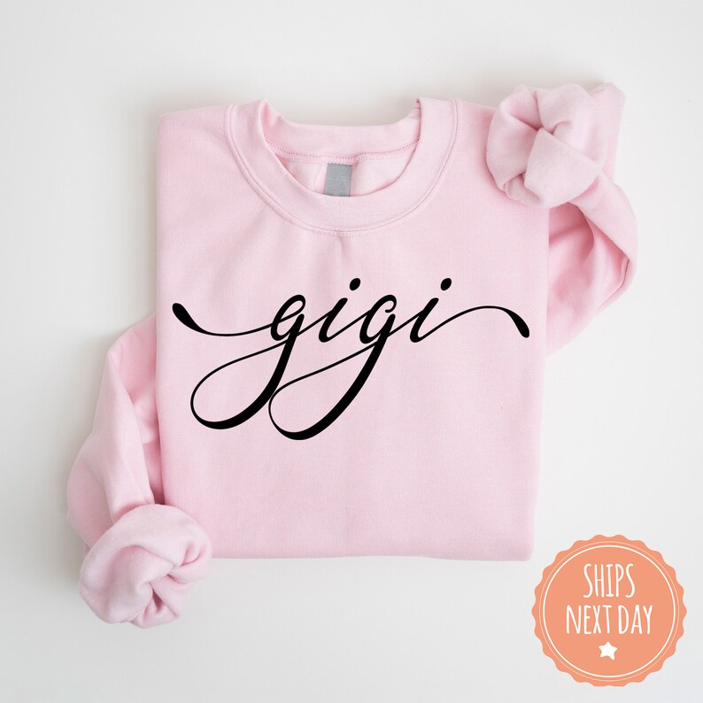 a pink shirt with the word gigi on it