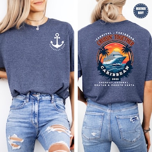a woman wearing a blue shirt with an anchor on it