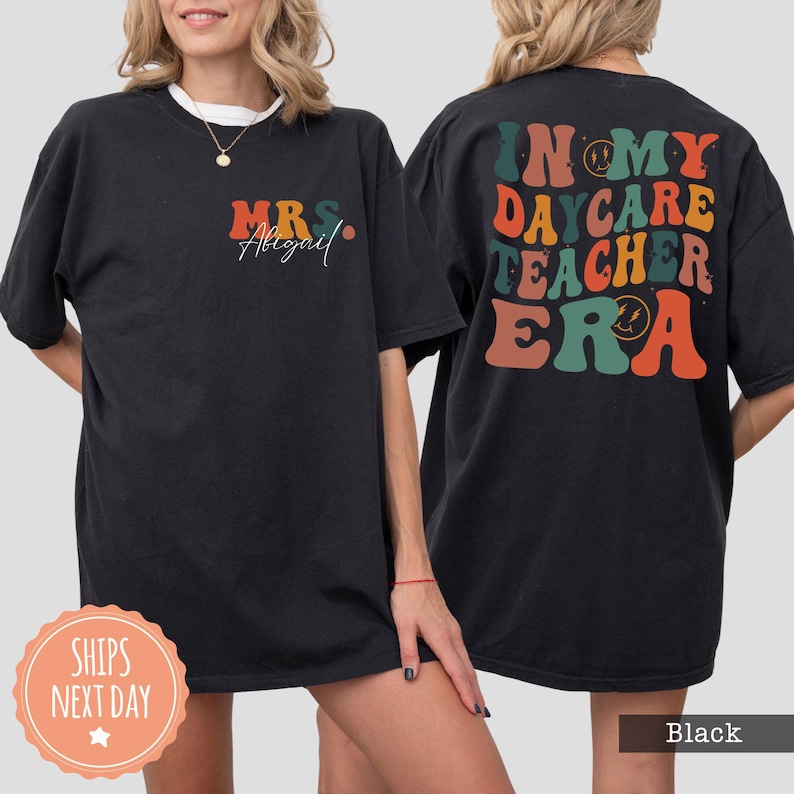 a woman wearing a black t - shirt with the words in my care teacher era