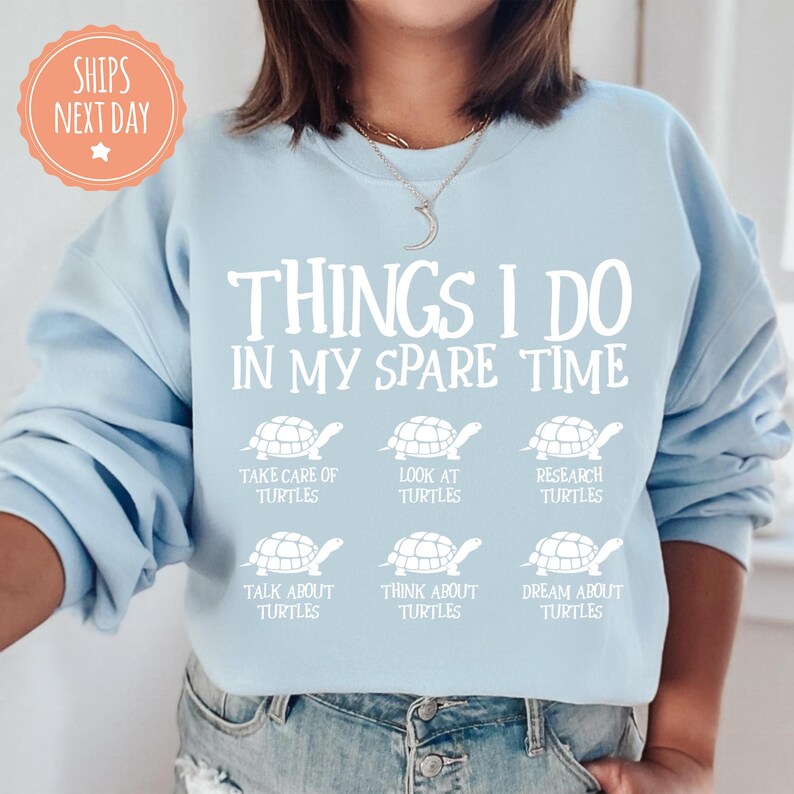 a woman wearing a sweatshirt that says things i do in my spare time