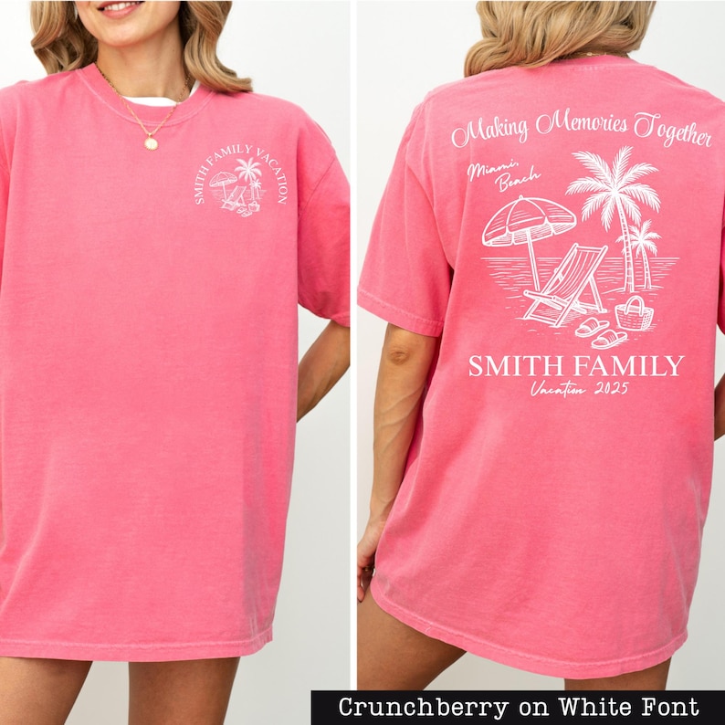 A woman wearing a pink t-shirt with a beach vacation design and text printed on the back.