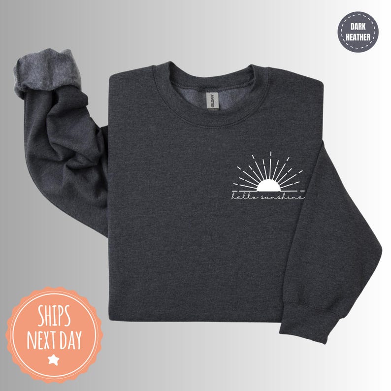 a black sweatshirt with a white sun on it