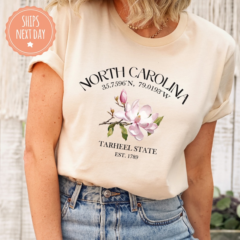 a woman wearing a north carolina t - shirt