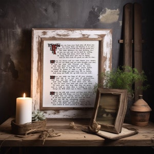 May include: A framed print with a white background and black text. The text is a poem titled "If" by Rudyard Kipling. The poem is about strength, resilience, and perseverance. The print is displayed on a wooden table with a candle and a small potted plant.