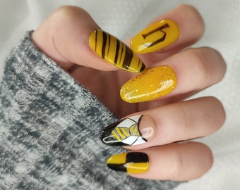 Handmade, reusable and customizable “press on” nails. Hufflepuff model