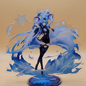 May include: A blue and white acrylic stand with a female anime character with long blue hair and a black outfit. The character is standing on a blue base with a snowflake design.