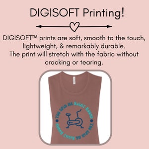 May include: A sleeveless, brown tank top with a blue graphic of a stationary bike and the text "YOU SPIN ME RIGHT ROUND" in a circular design. The top is made of a soft, lightweight material.