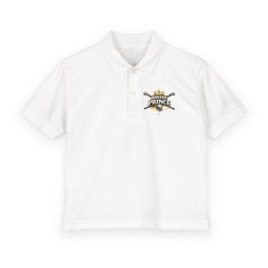 May include: White polo shirt with short sleeves and a collar. The shirt features a logo on the left chest that says "Birdie Prince" with a golf-themed design including crossed golf clubs, a crown, and a golf ball.