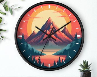 May include: A black framed clock with a colorful mountain scene and a lake. The clock face has a sunset color scheme with orange, red, and yellow hues. The mountain is a dark purple and blue color. The lake is a light blue color. The clock hands are black.