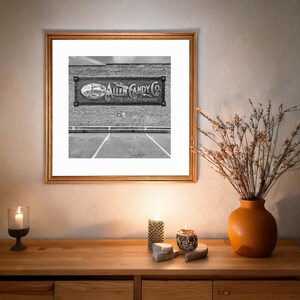 Brick wall with restored Allen Candy sign on Route 66