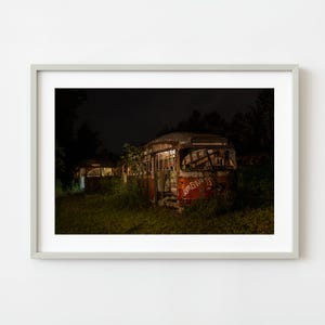 Rusting street car busses at night | Wall Art
