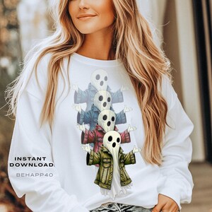May include: White sweatshirt featuring a graphic of four ghosts wearing jackets in different colors: blue, red, and green. The text "INSTANT DOWNLOAD" and "BEHAPP40" are printed on the left side of the sweatshirt.