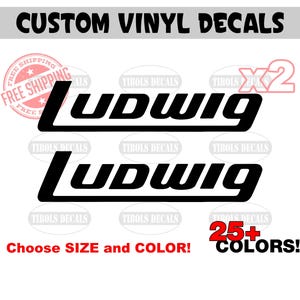 May include: Two black vinyl decals with the word "Ludwig" in a stylized font. The decals are available in 25+ colors and come in a pack of two.