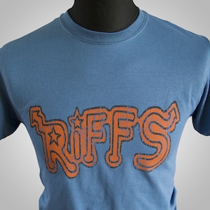May include: A blue t-shirt with an orange graphic of the word "RIFFS" in a retro style font.