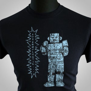May include: A black t-shirt with a blue robot graphic and the text "INTERGALACTIC..." printed on the front.