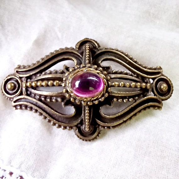 Victorian revival dark brooch purple center stone 