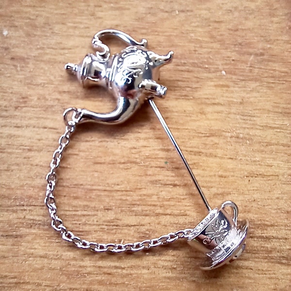 Whimsical Avon teapot brooch interactive moving pin cute silver coffee pot pouring into cup British style jewelry granny chic 80s stickpin