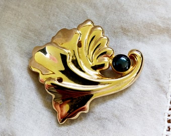 Gold tone leaf brooch abstract organic form pin vintage 80s lapel jewelry flower plant scarf clip bright shiny with black accent artistic